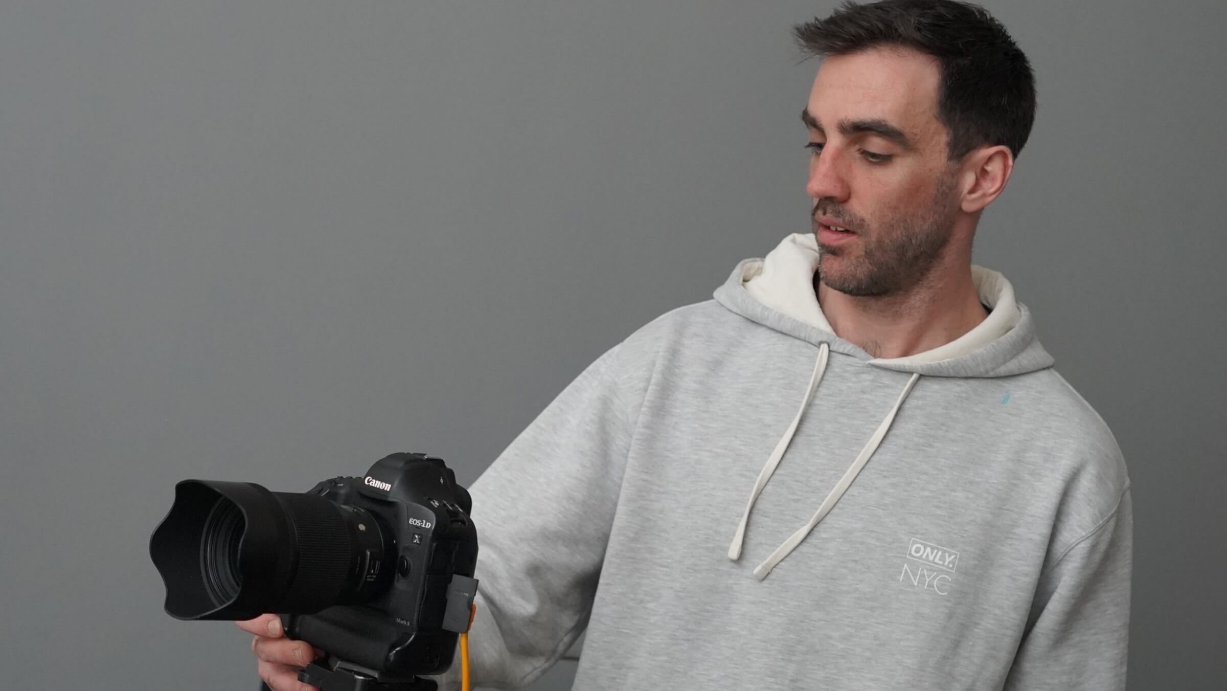 Man holding canon camera